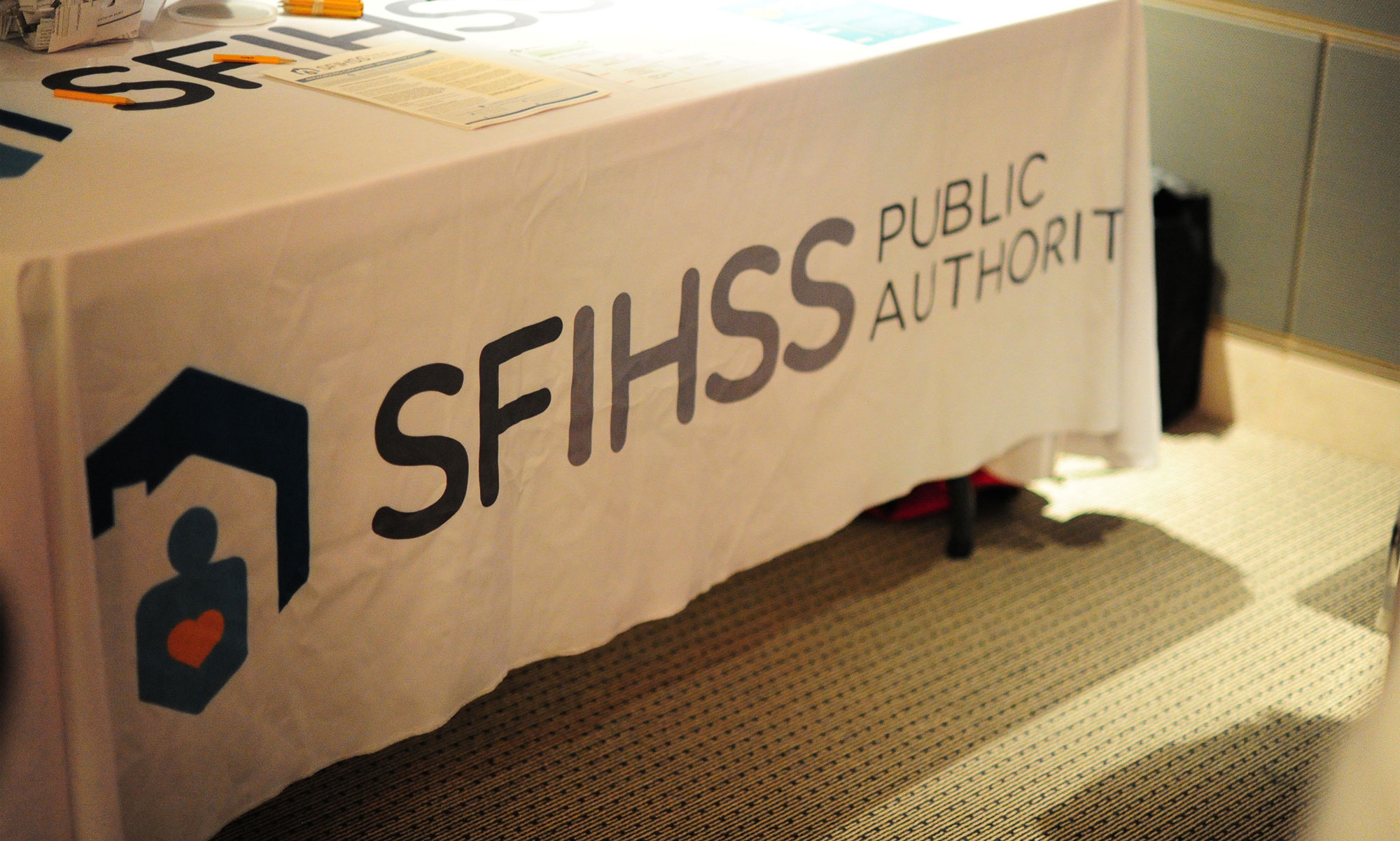 Photo of a trade show table with the SFIHSSPA logo
