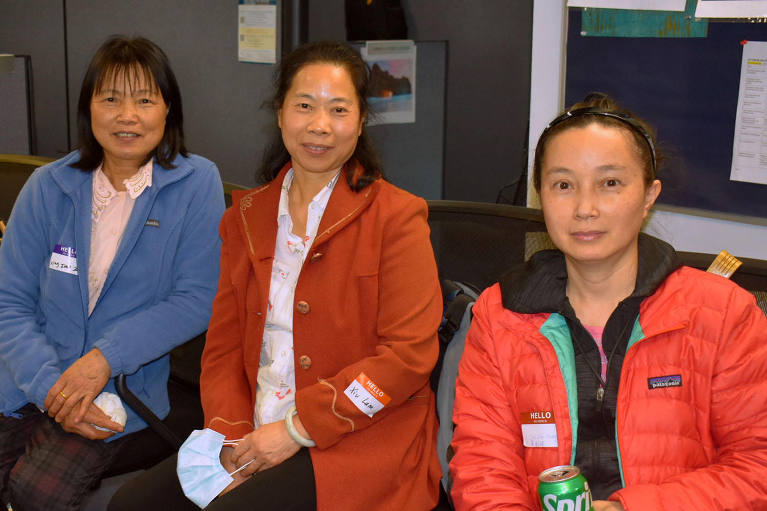 Photo of three female care providers sitting together at an event hosted by SFIHSSPA.