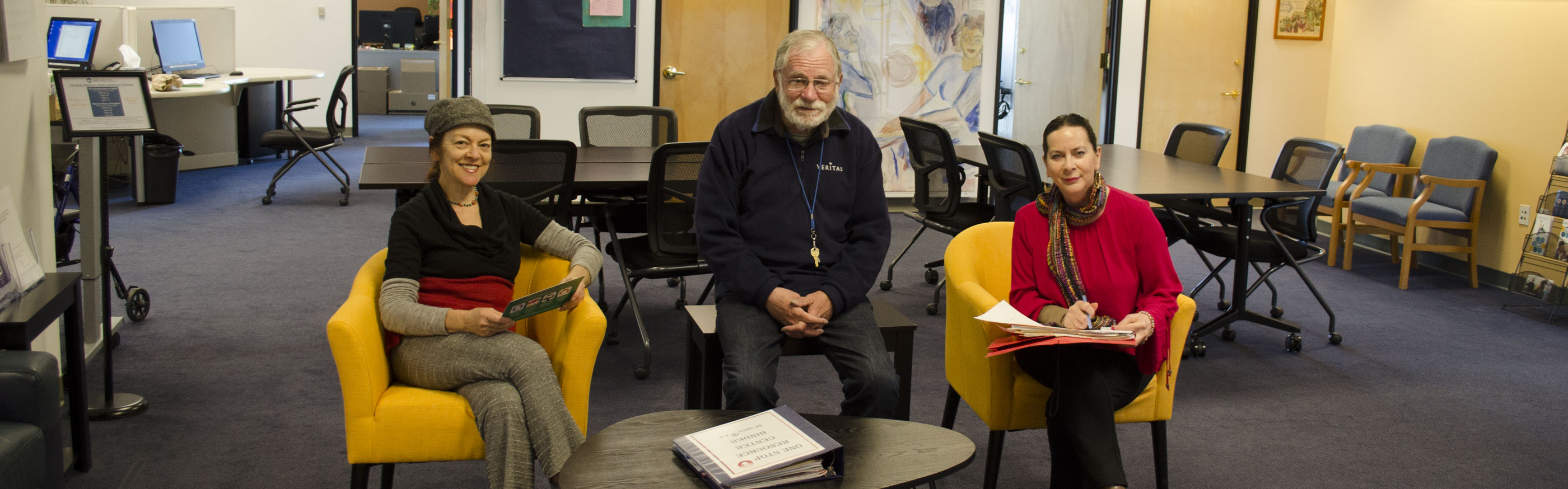 Photo of three individuals at the One-Stop Resource Center.